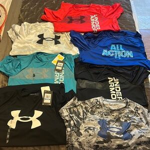 7 kids Under Armour quick dry t-shirts. All size XL.
